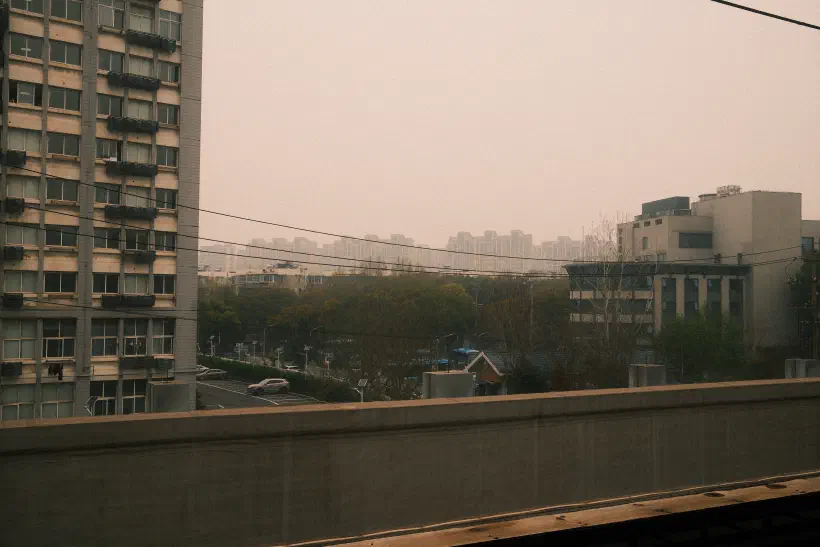 a view of residential nanjing taken from a subway platform