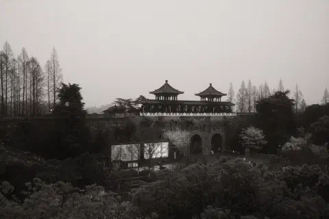a black and white photo of Xuanwu Men, the gate to the Xuanwu lake