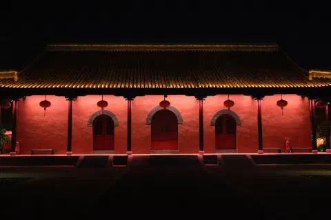 a quiet temple at night, missing the crowds present during the day