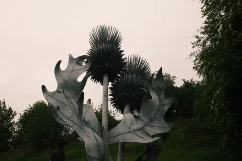 a sculpture of a thistle