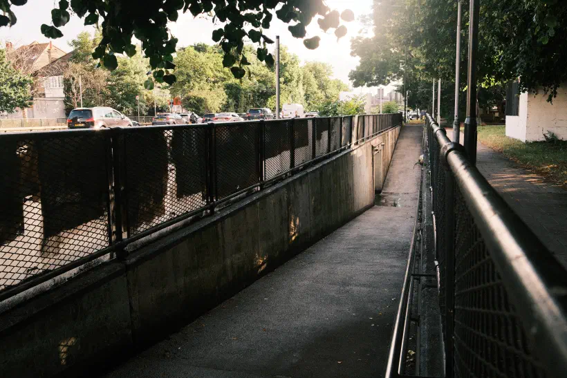 a photo of an underpass looking down the ramp towards the tunnel entrance