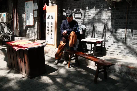 Asleep in the sun. Away from the crowds it amazes me that people still call the hutongs home.